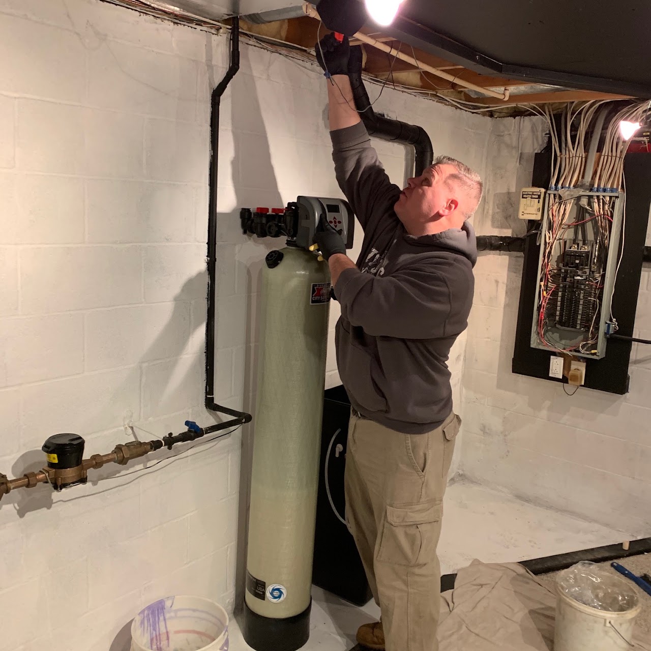 Good Faith plumber installing a water treatment system
