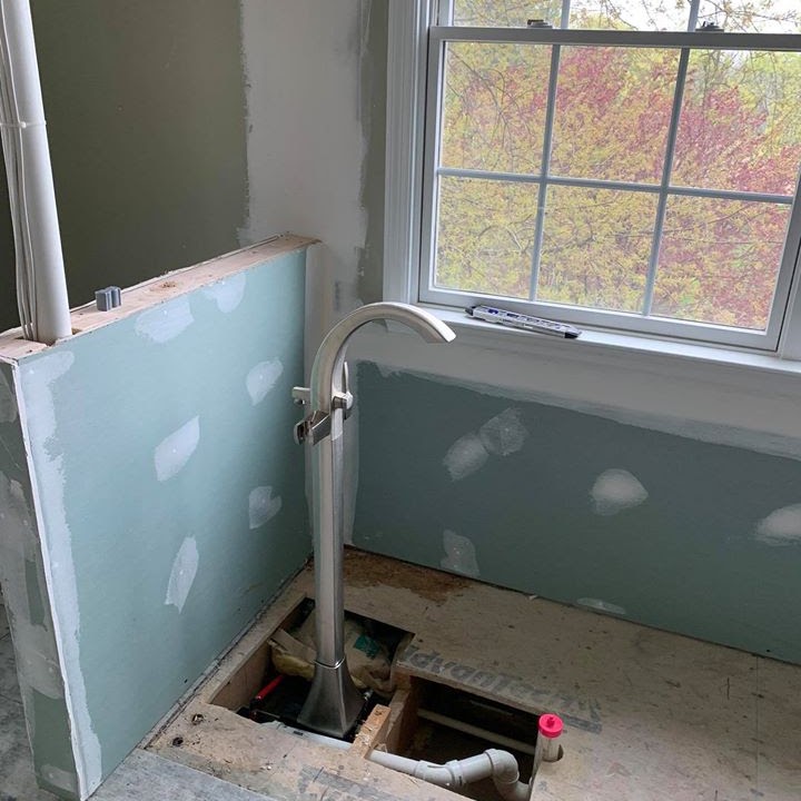 New tub filler and bathroom plumbing installation